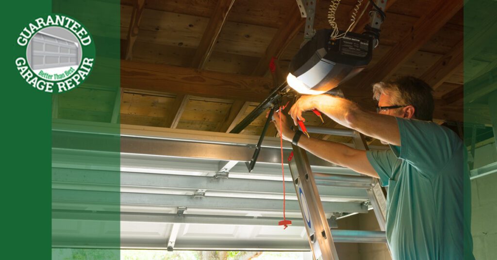 A man adjusting the chain on a garage door opener.