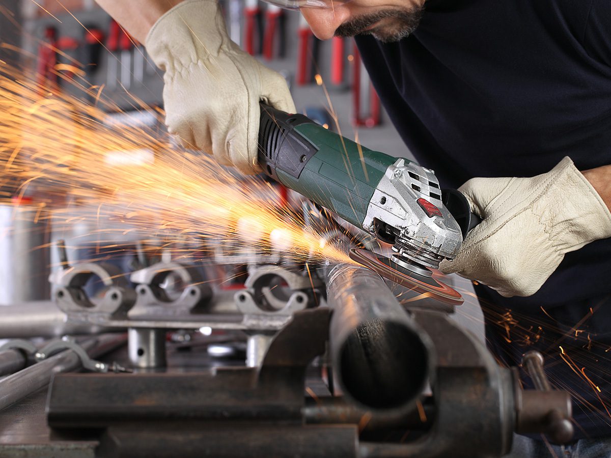 1200x900GMB-1-insul A man using a metal grinder in his garage