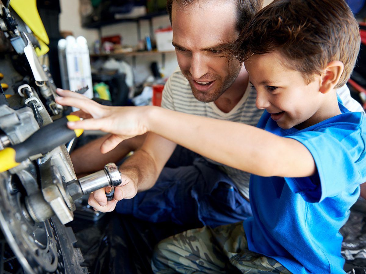 1200x900GMB-3-insul A father and son working on a motorcycle in their garage