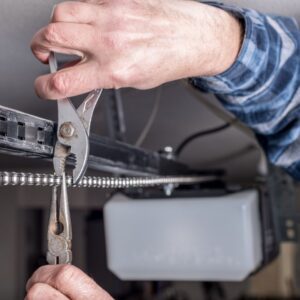 img of someone working on a garage door