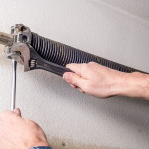 img of someone working on a garage door